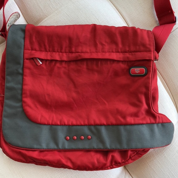 tumi tech crossbody bag